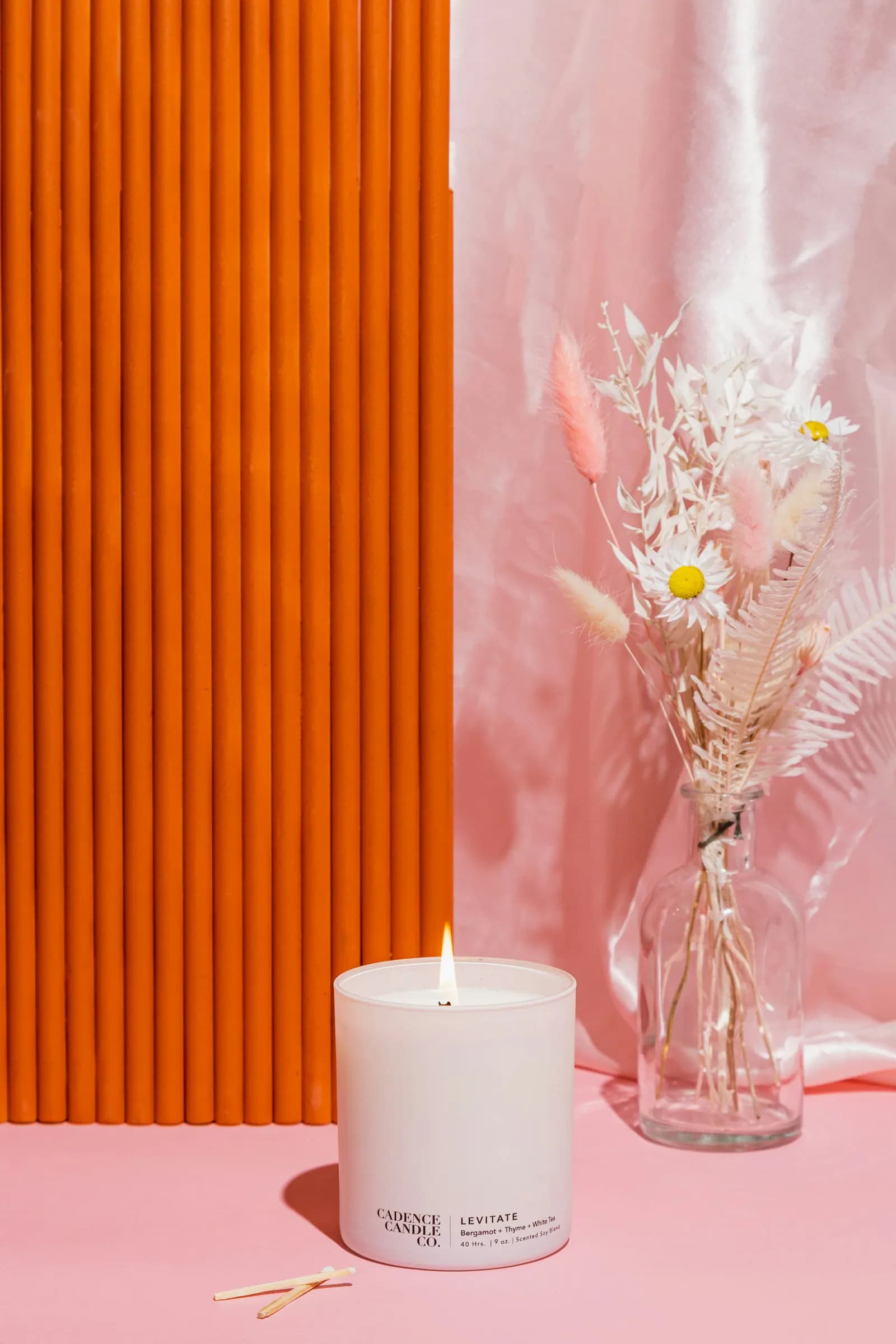 Colourful candle and dried floral arrangement inspiring a new design